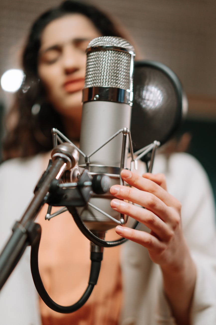 woman singing in a recording studio